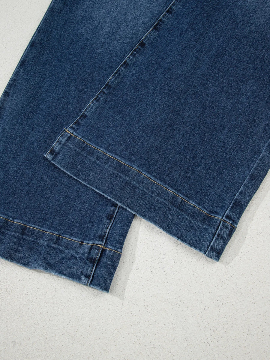 Close-up of blue denim fabric on a white background