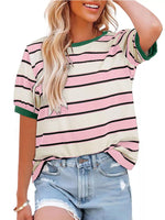 Woman wearing a striped shirt with pink, white, and green colors.