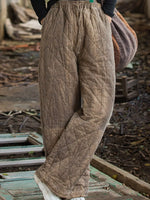 Woman wearing a brown Quilted High-Waisted Wide-Leg Casual Pants