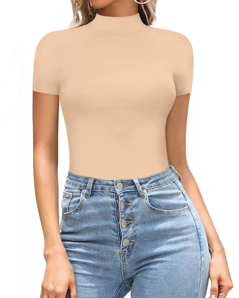 Person wearing a beige short-sleeve top and blue jeans on a white background