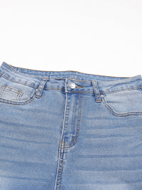 Close-up of a blue denim skirt on a white background