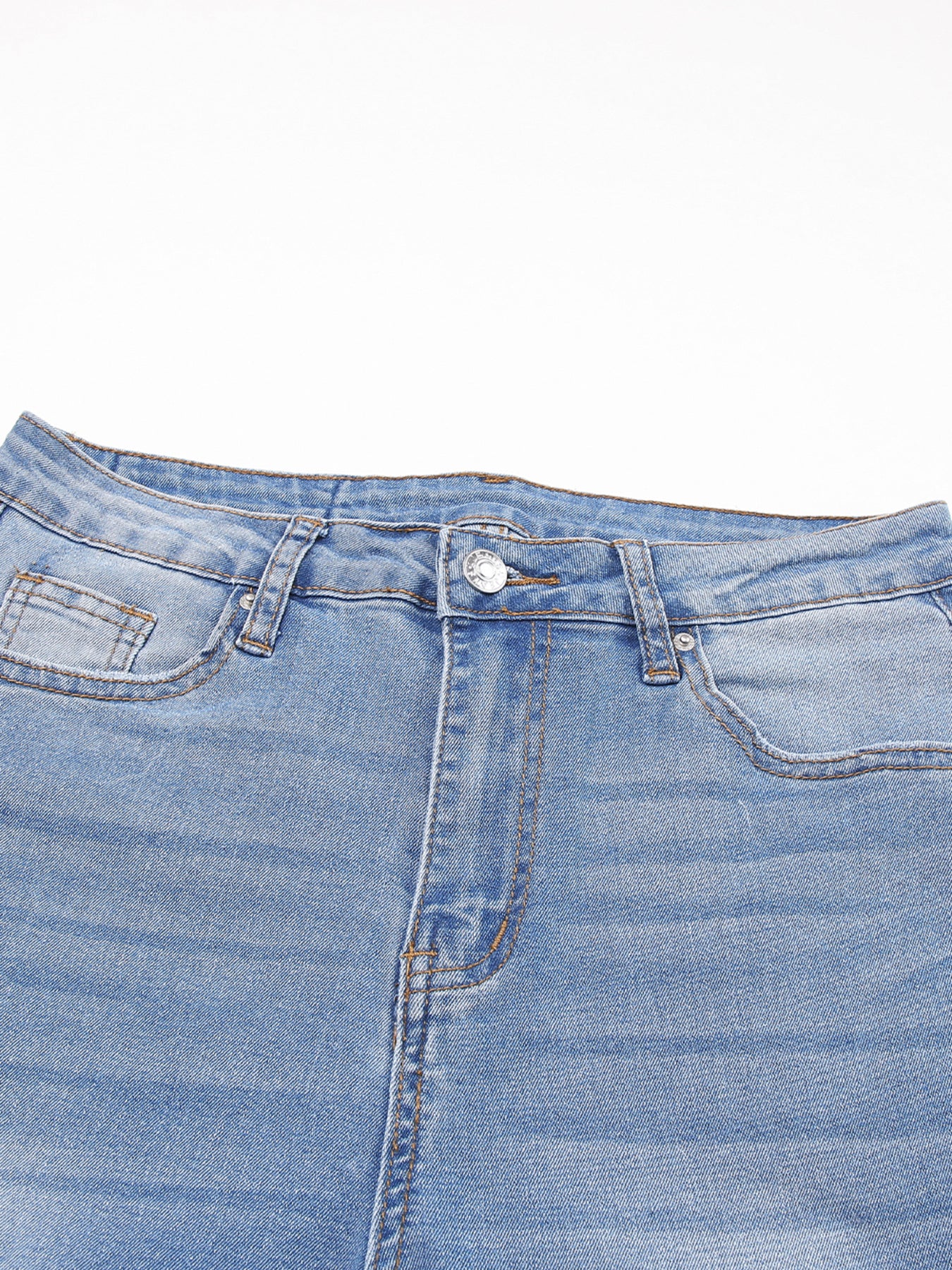 Close-up of a blue denim skirt on a white background