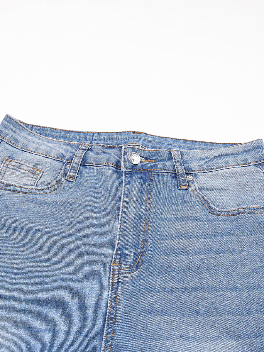Close-up of a blue denim skirt on a white background