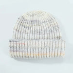 Knitted beanie with multicolor pattern on a light gray background