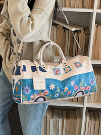Person holding a floral-patterned handbag with a car design in a library setting