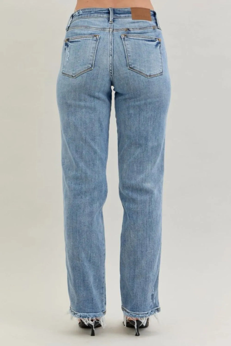Light blue jeans on a plain background