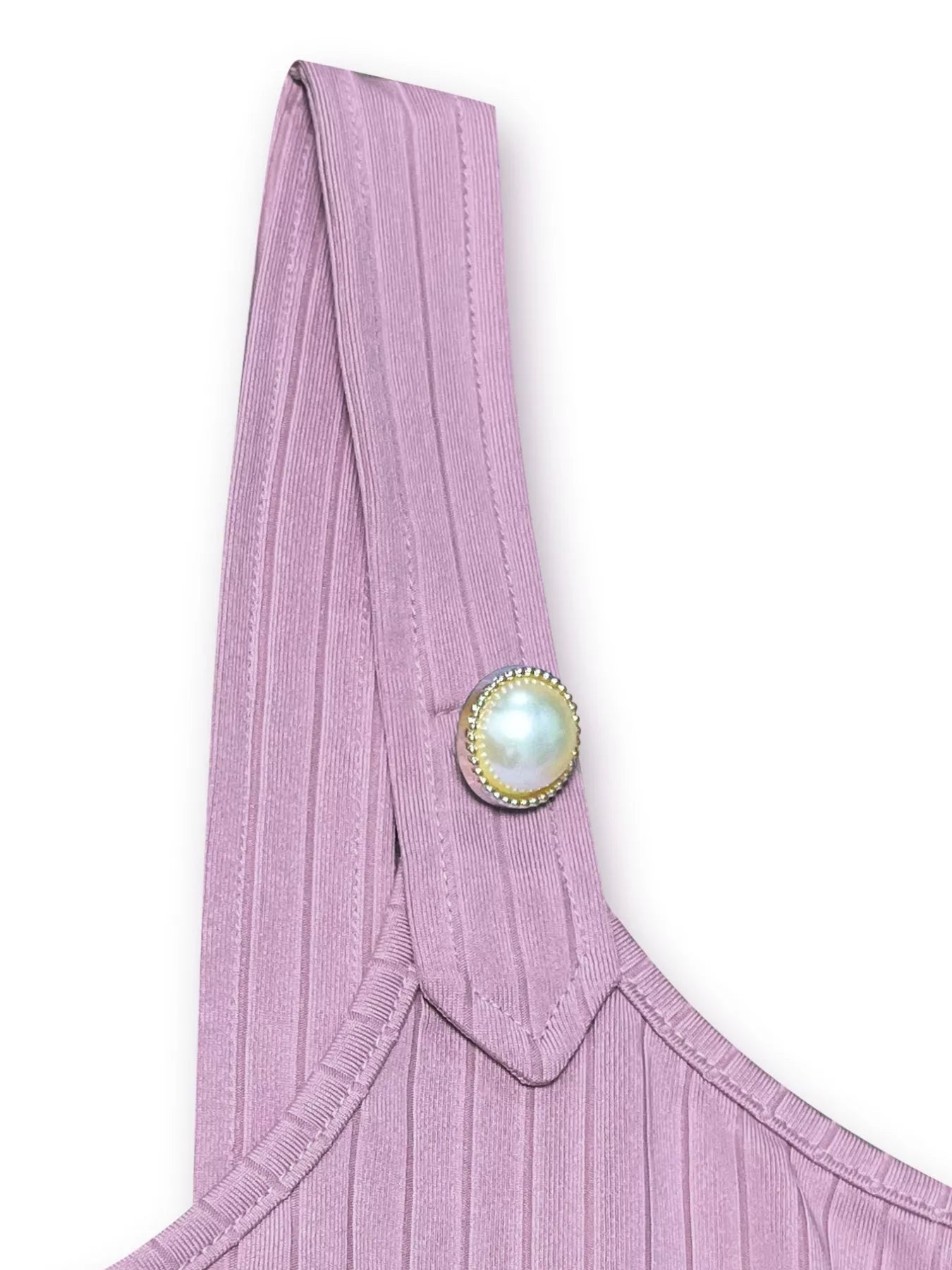 Pink garment with a decorative button on a white background