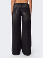 Black wide-leg jeans on a white background