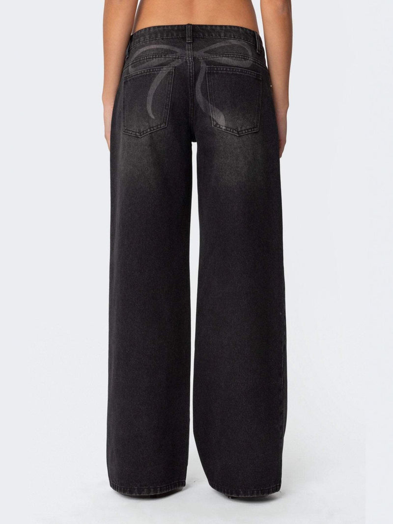 Black wide-leg jeans on a white background