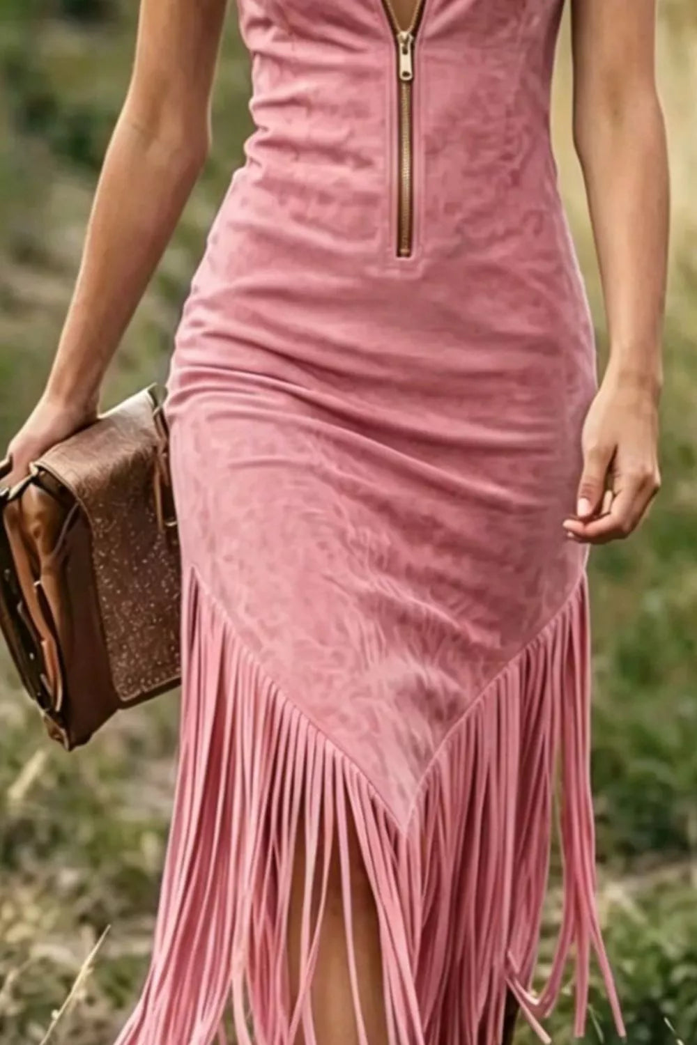 Pink fringed dress worn by a person in an outdoor setting