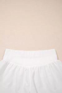 White pants on a beige background