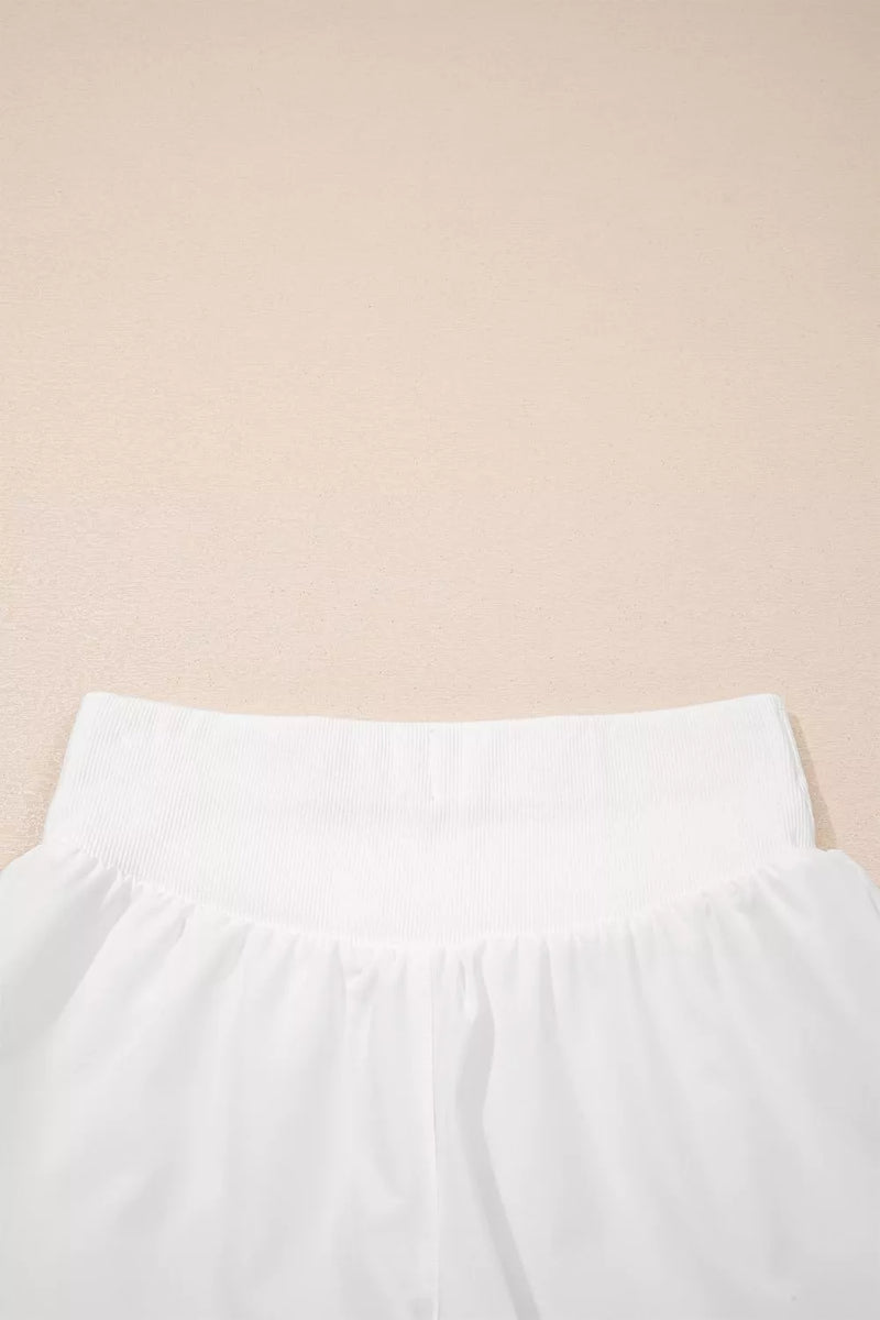 White pants on a beige background