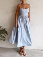 Light blue dress worn by a person against a plain background