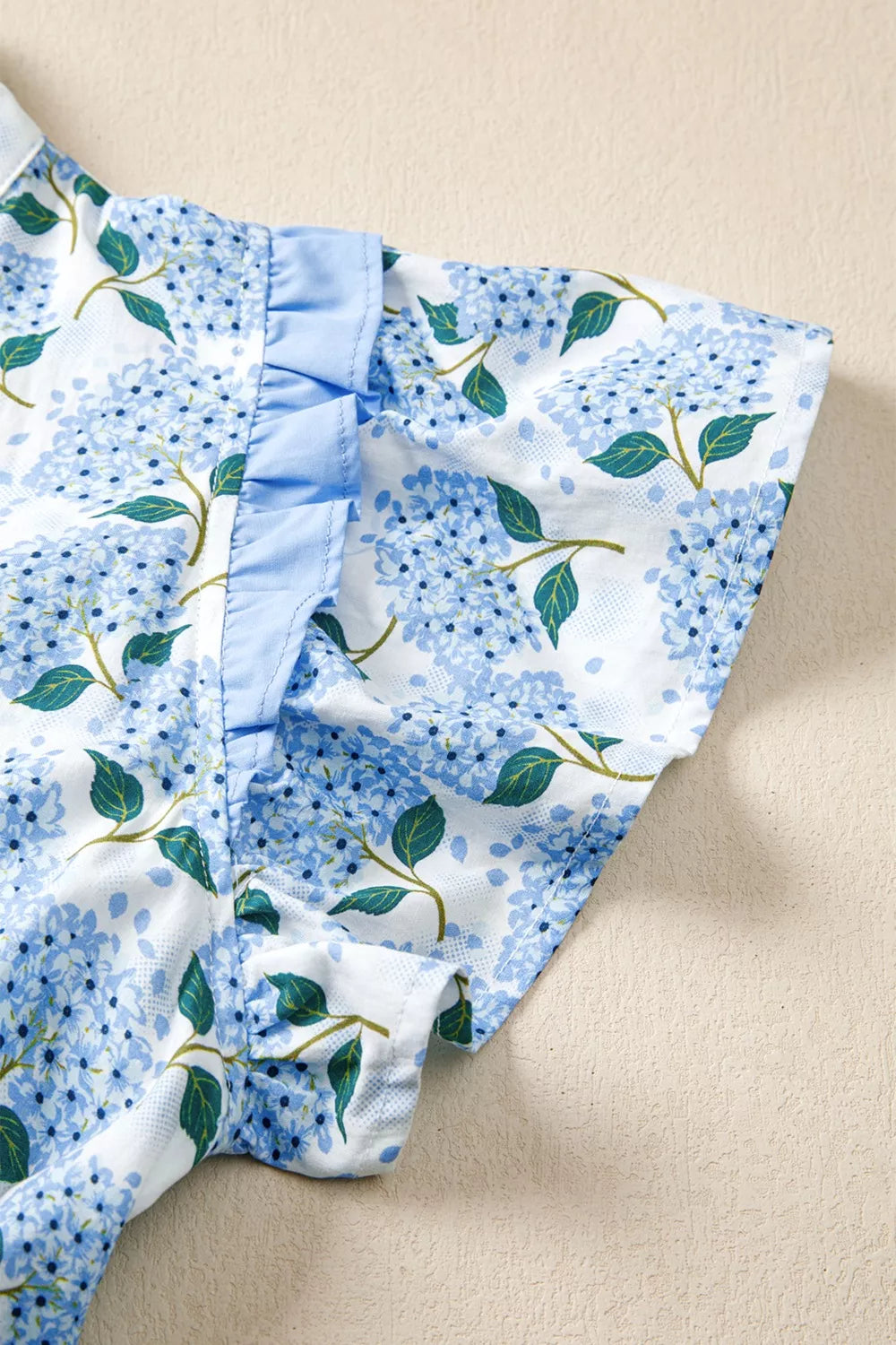 Blue floral fabric on a beige background