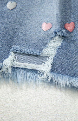 View of hem on Distressed Raw Hem Heart Denim Skirt