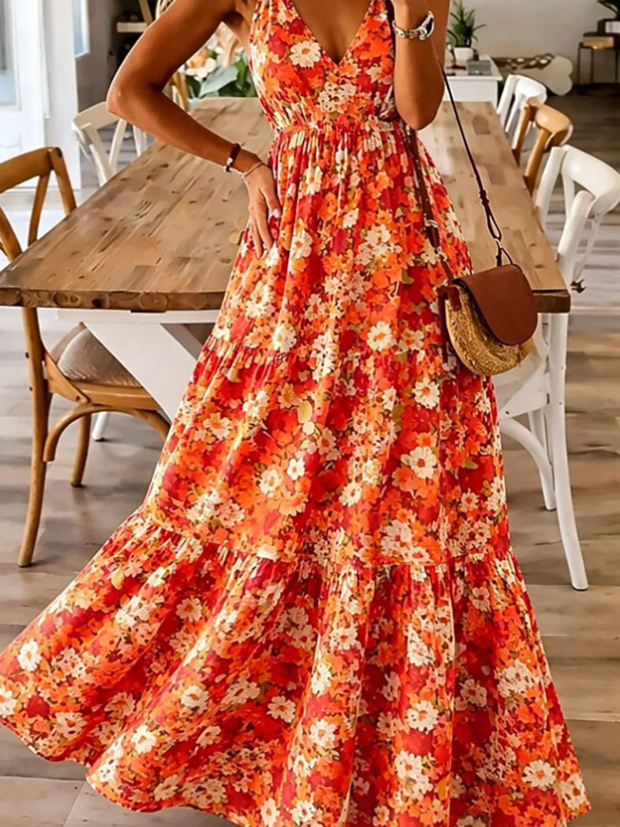 Person wearing a red floral dress in a dining room setting