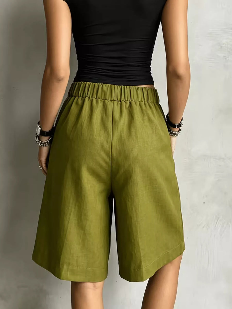 Woman showing the back of High-Waisted Drawstring Shorts 