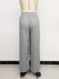 Gray sweatpants on a mannequin against a white background