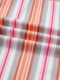 Close-up of striped fabric with red, orange, and gray lines on a white background