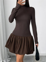 Brown dress worn by a person against a neutral background
