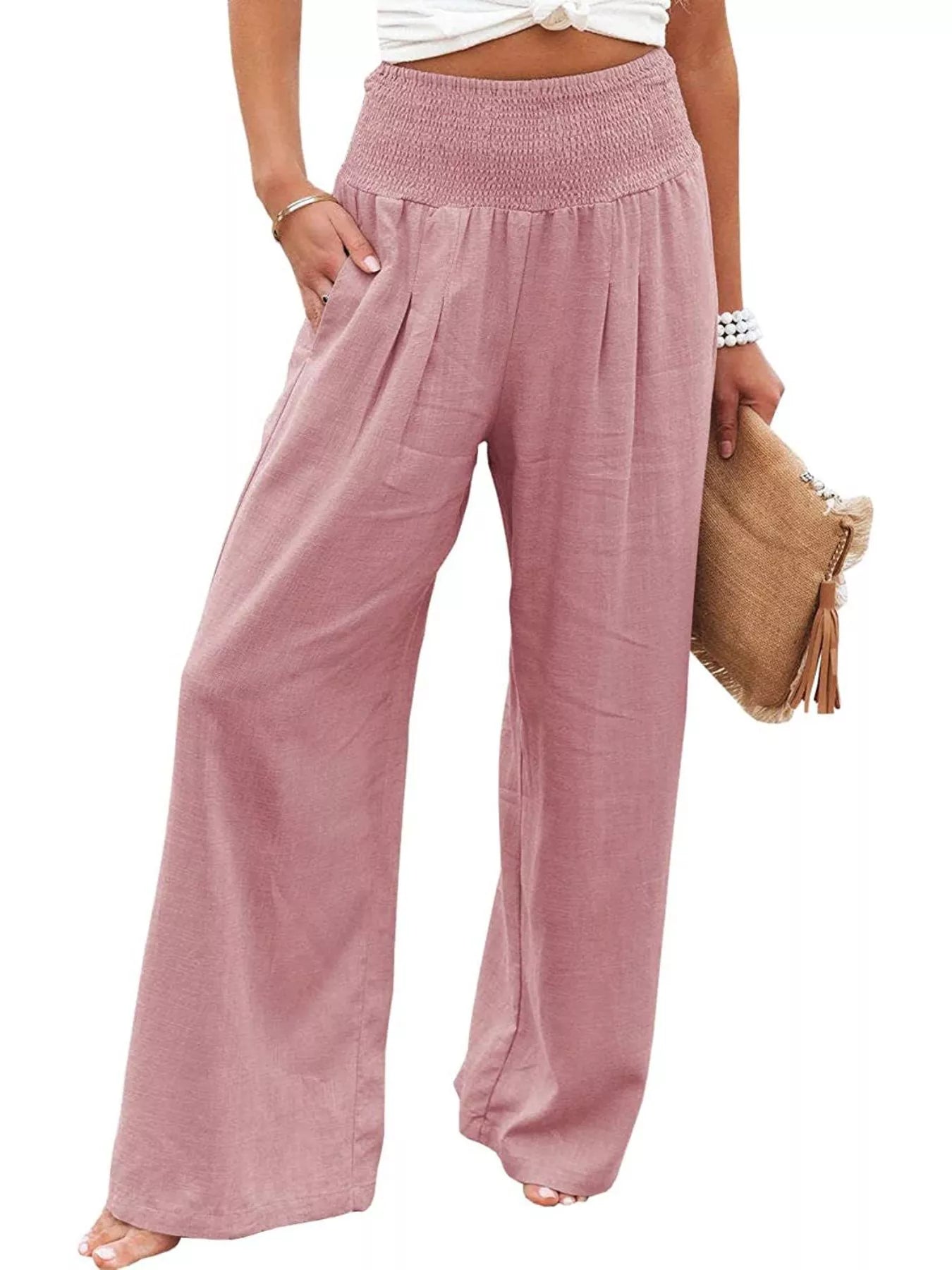 Pink wide-leg pants worn by a person on a white background