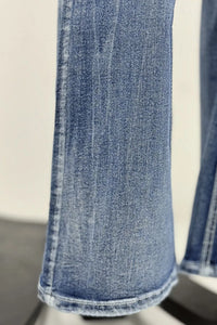 Close-up of blue jeans on a white background