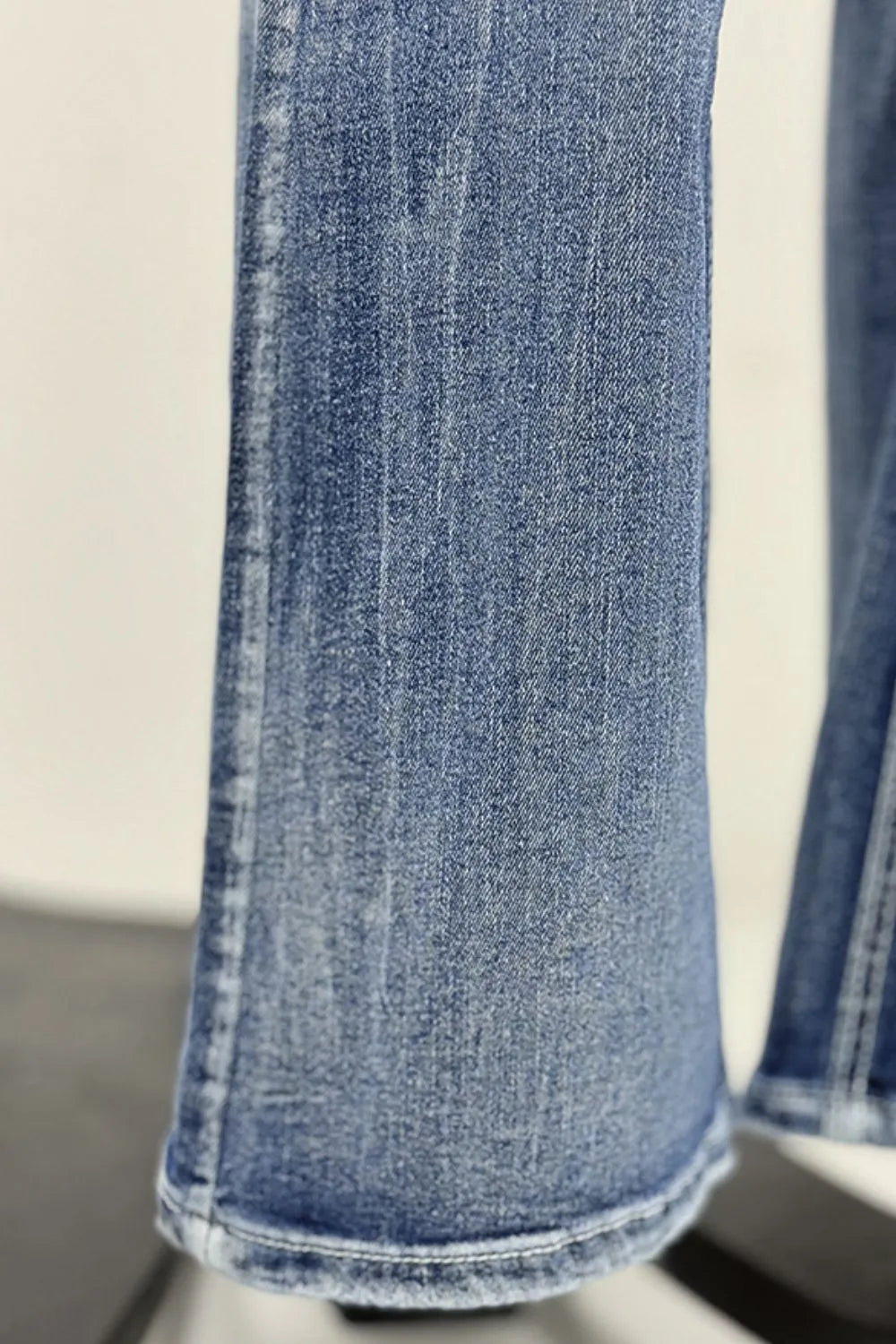 Close-up of blue jeans on a white background