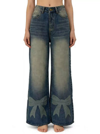 Wide-leg jeans with bow designs on a white background
