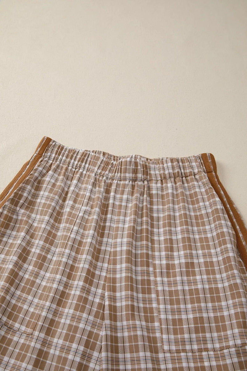 Plaid pants with brown and white pattern on a beige background