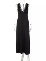 Black dress with lace detailing on a mannequin against a white background