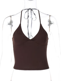 Brown halter top on a mannequin against a white background