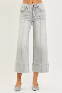 Light gray wide-leg jeans on a plain background