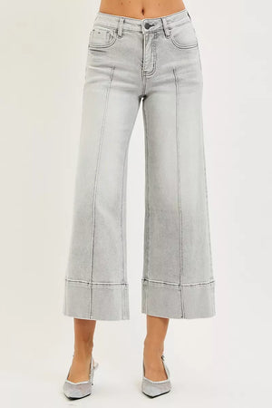 Light gray wide-leg jeans on a plain background