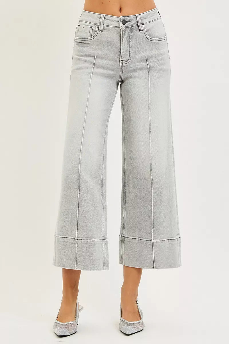 Light gray wide-leg jeans on a plain background