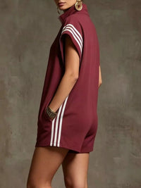 Maroon dress with white stripes on a plain background