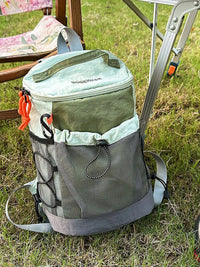Cooler bag with backpack straps on grass