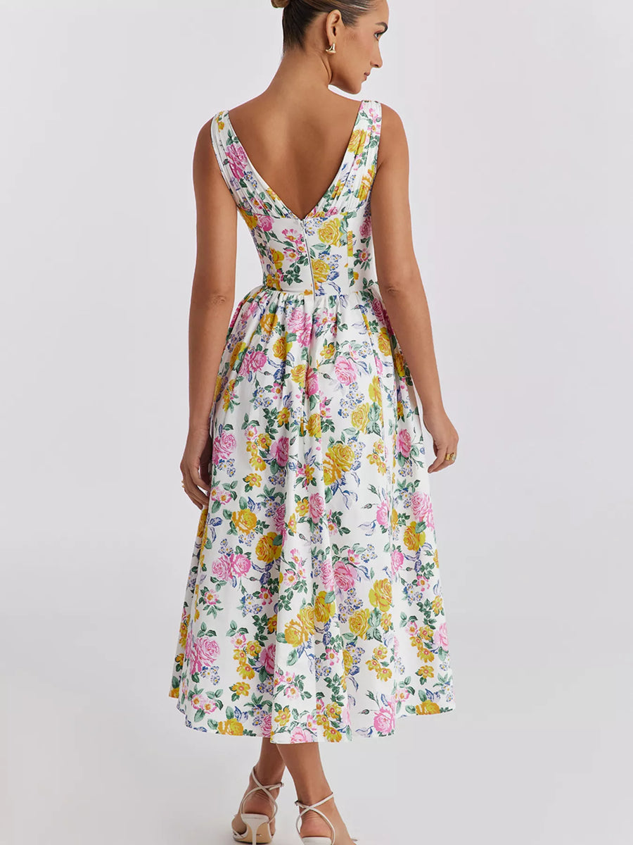 Woman wearing a floral dress on a plain background
