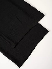 Black fabric on a white background