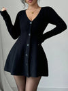 Black cardigan dress worn by a model on a plain background
