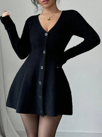 Black cardigan dress worn by a model on a plain background