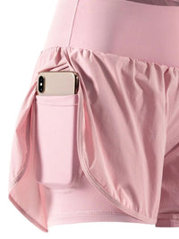 Pink skirt with a pocket holding a phone on a white background