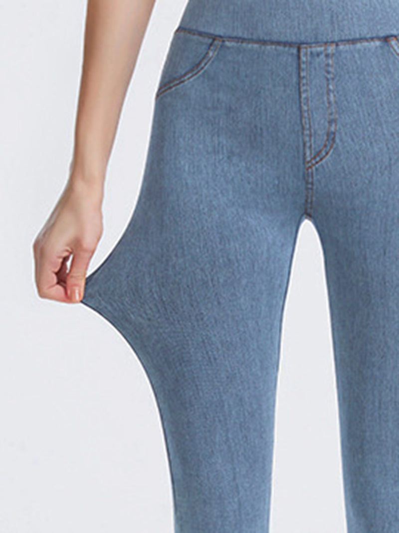 Close-up of blue jeans on a white background