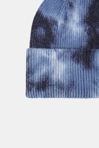 Tie-dye beanie with blue and black pattern on a white background