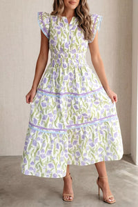 Woman wearing a floral dress with a neutral background