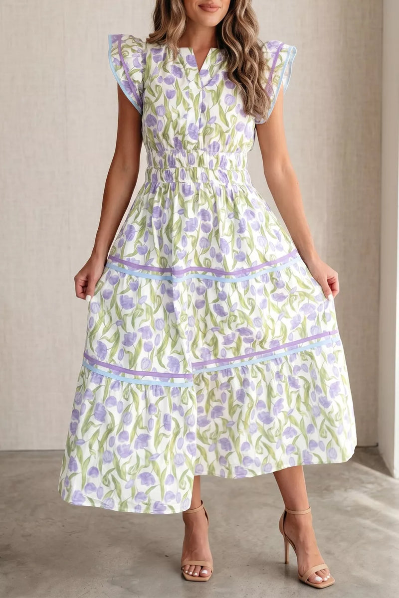 Woman wearing a floral dress with a neutral background