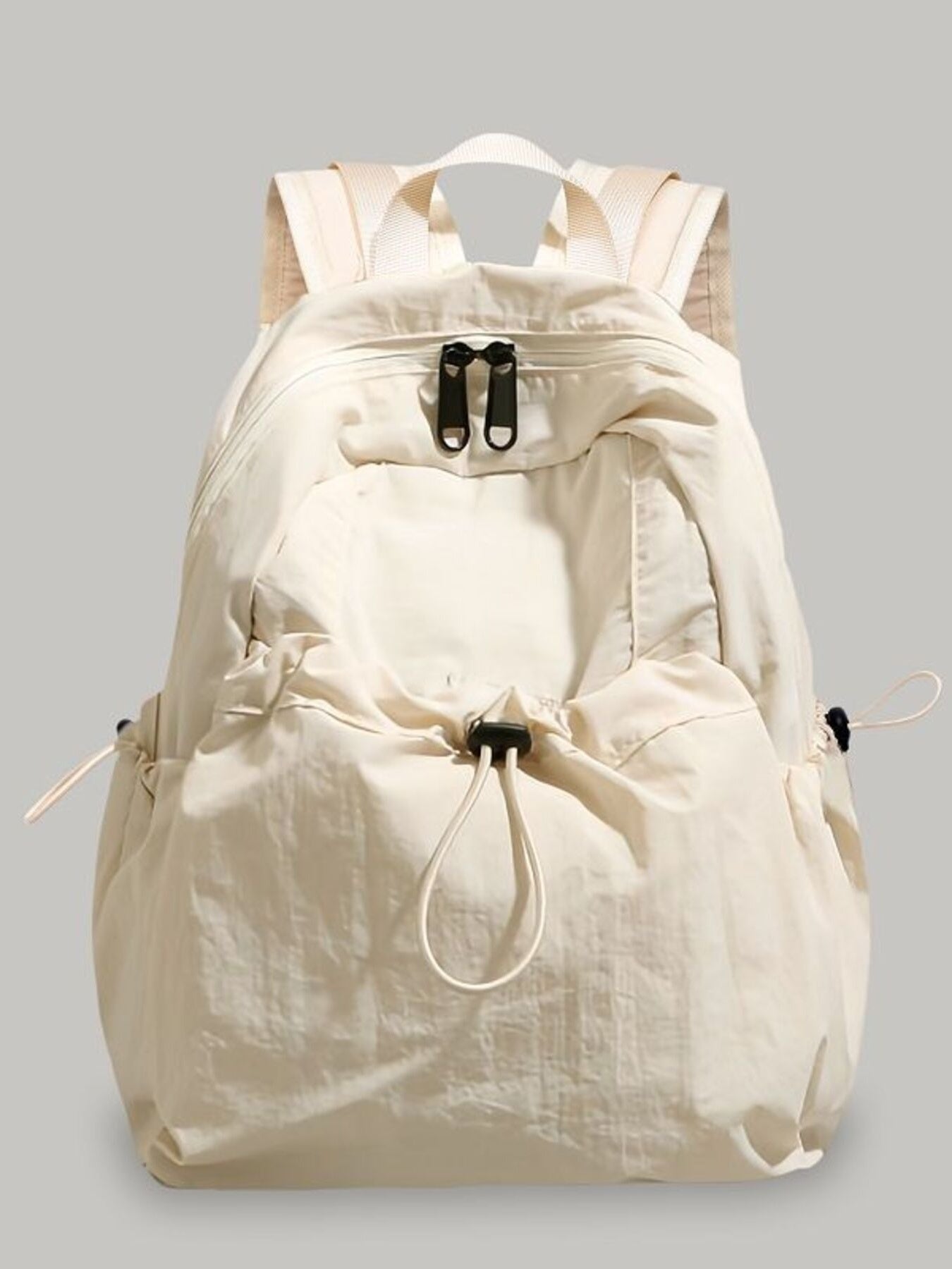 Beige backpack on a gray background