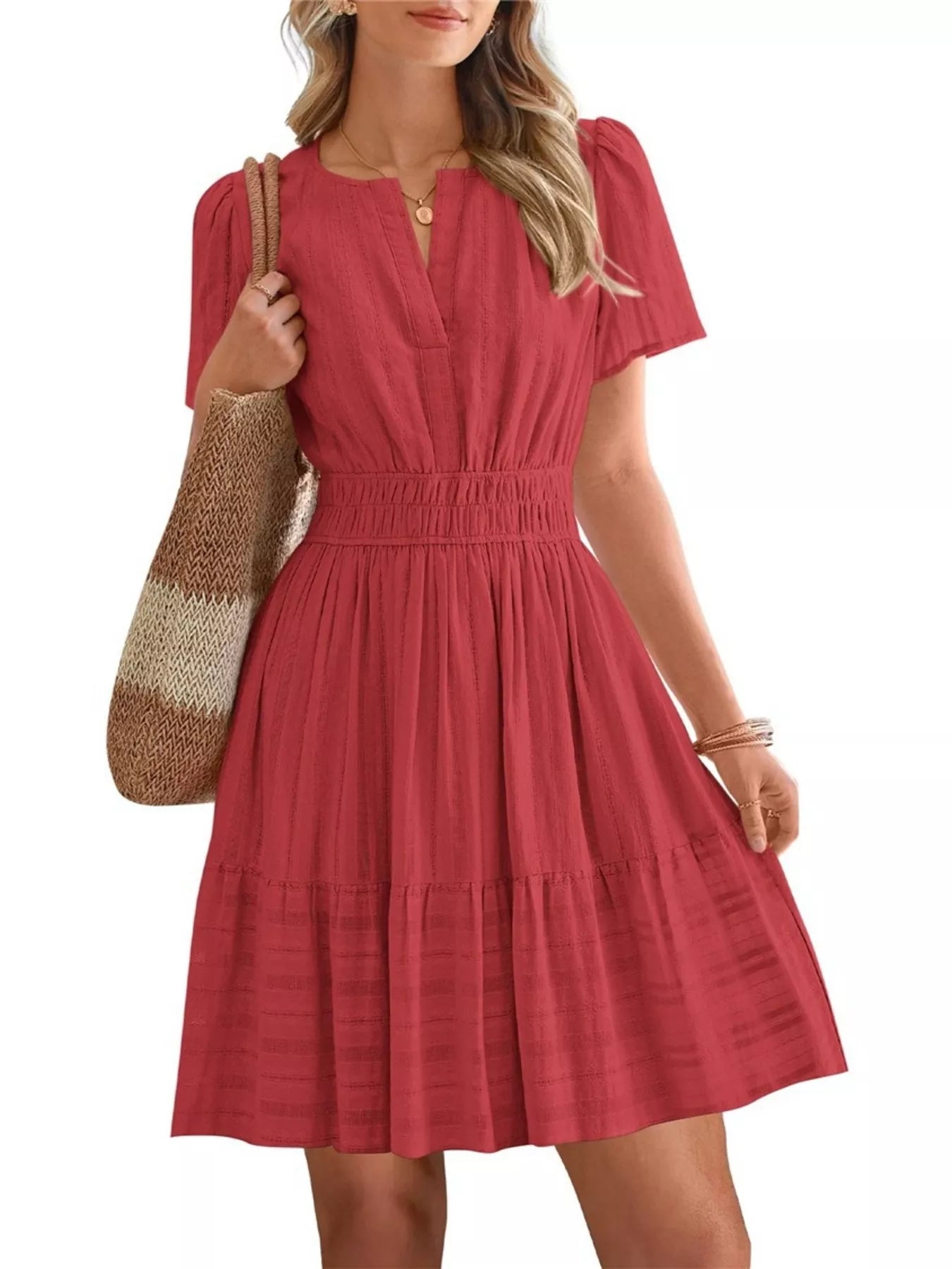 Red dress worn by a person on a white background