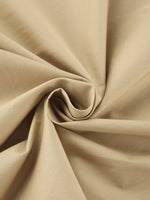 Close-up of beige fabric with folds
