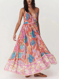 Woman wearing a colorful floral dress on a white background