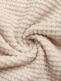 Close-up of beige textured fabric